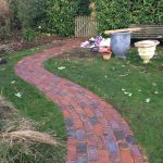 Brick path leading to a gate